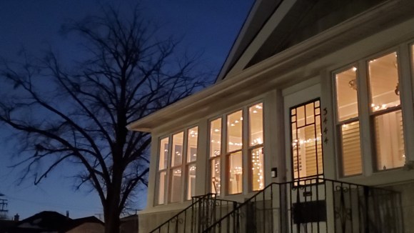 Holiday house with tree at dusk